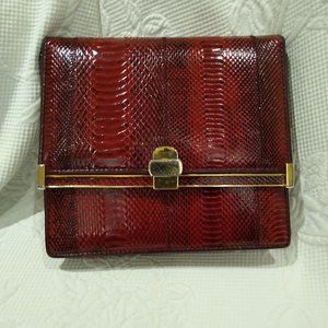 Red reptile skin and gold tone clutch